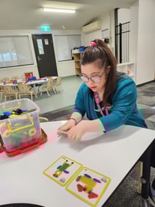 Olivia assisting with set up for playgroup