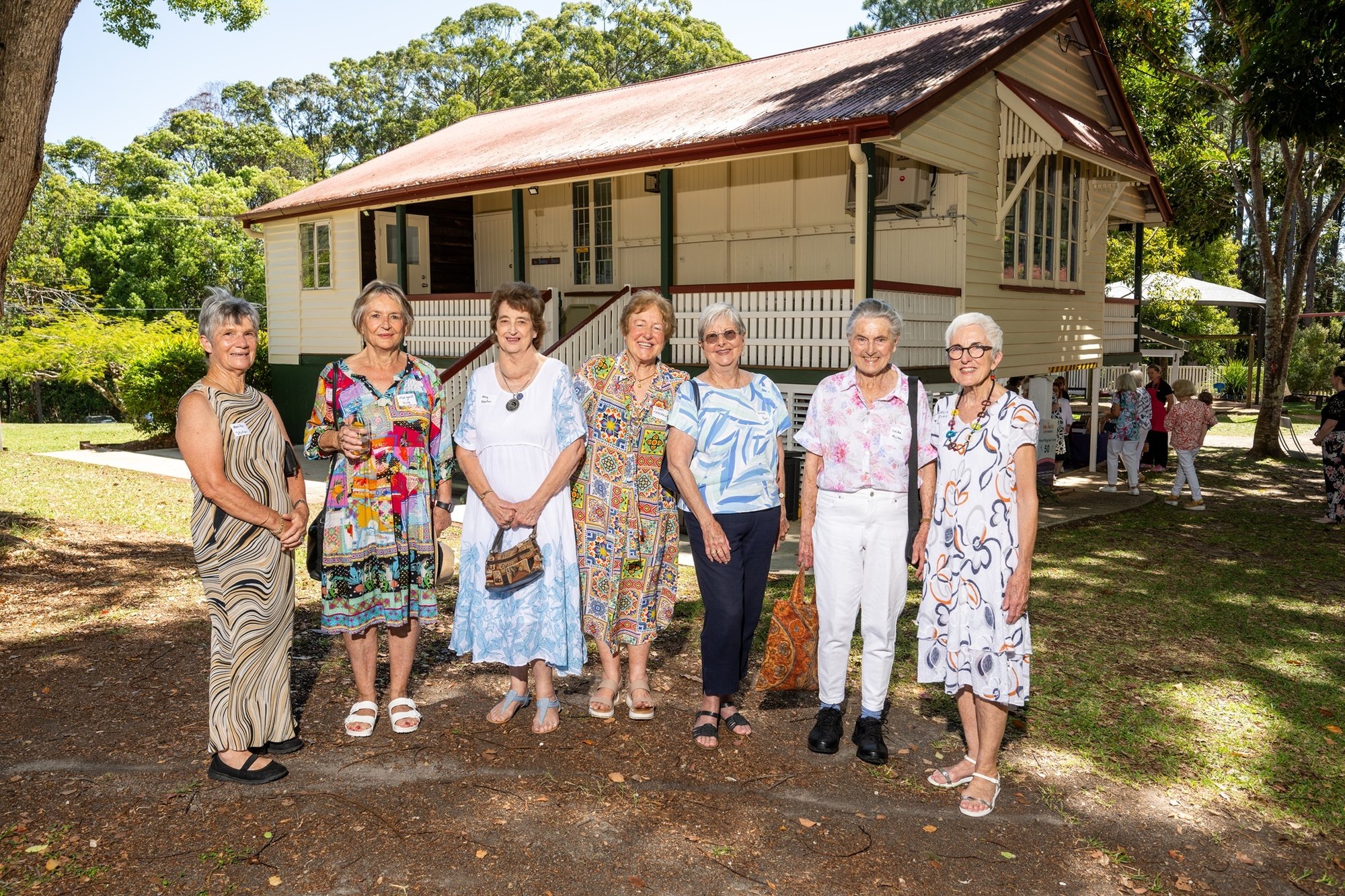 Foundational Members of the Mons Playgroup in 1975 stand infront of the building