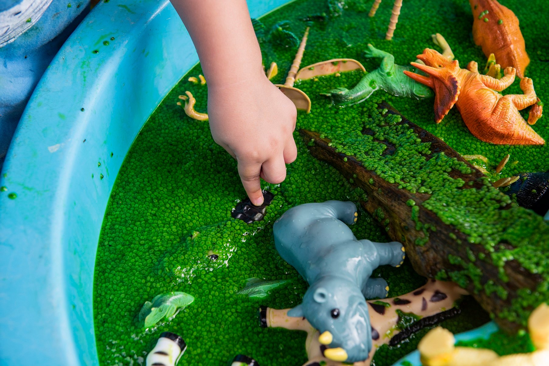 Small world dinosaur swamp sensory play