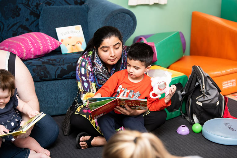 Parent engaging child in conversational reading at Mt Isa Playgroup Hub