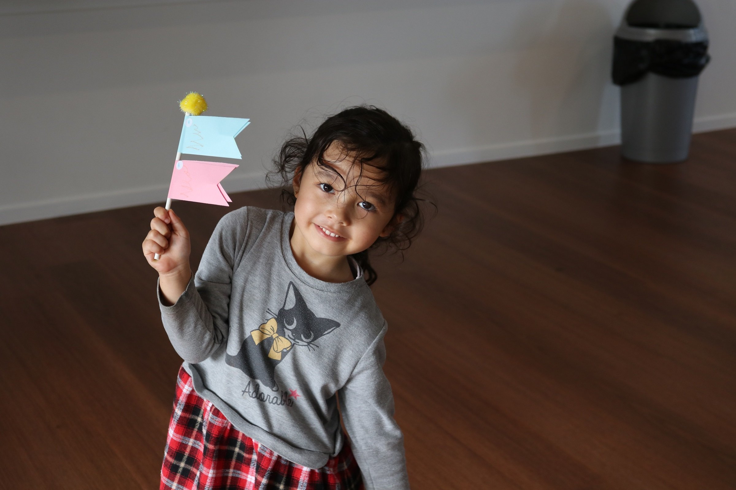 Child with koinobori they made at playgroup