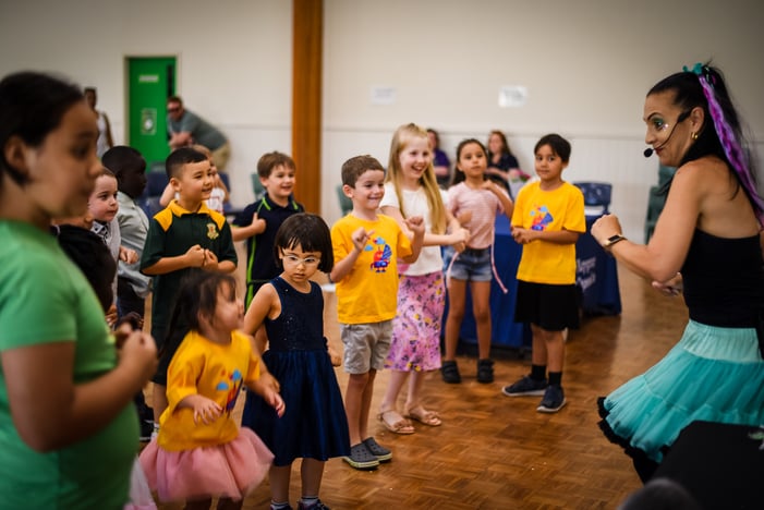 A group of children dancing with entertainer