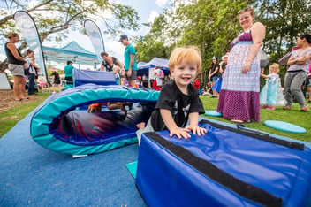 Young child completing obstacle course