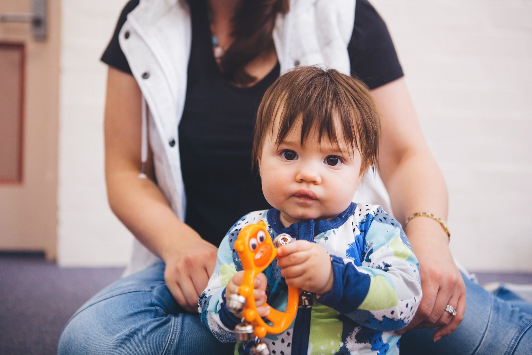 Baby playing with bells during playgroup music session