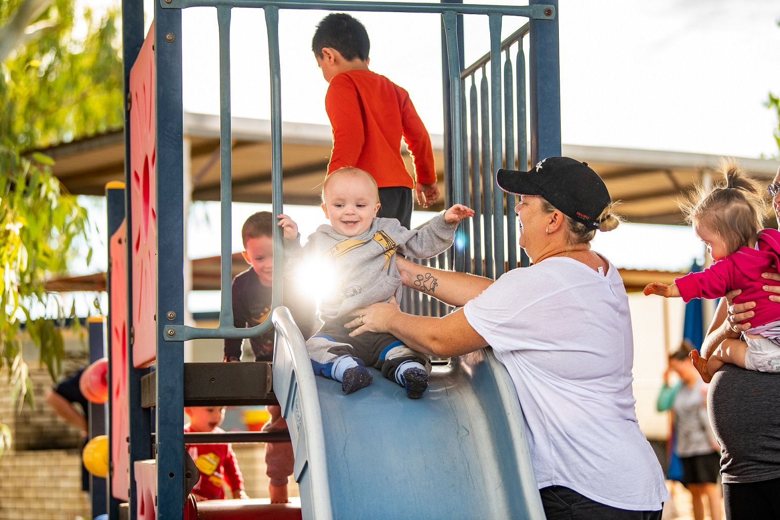 Parent and child enjoying the playground at the Play Matters Mt Isa Hub