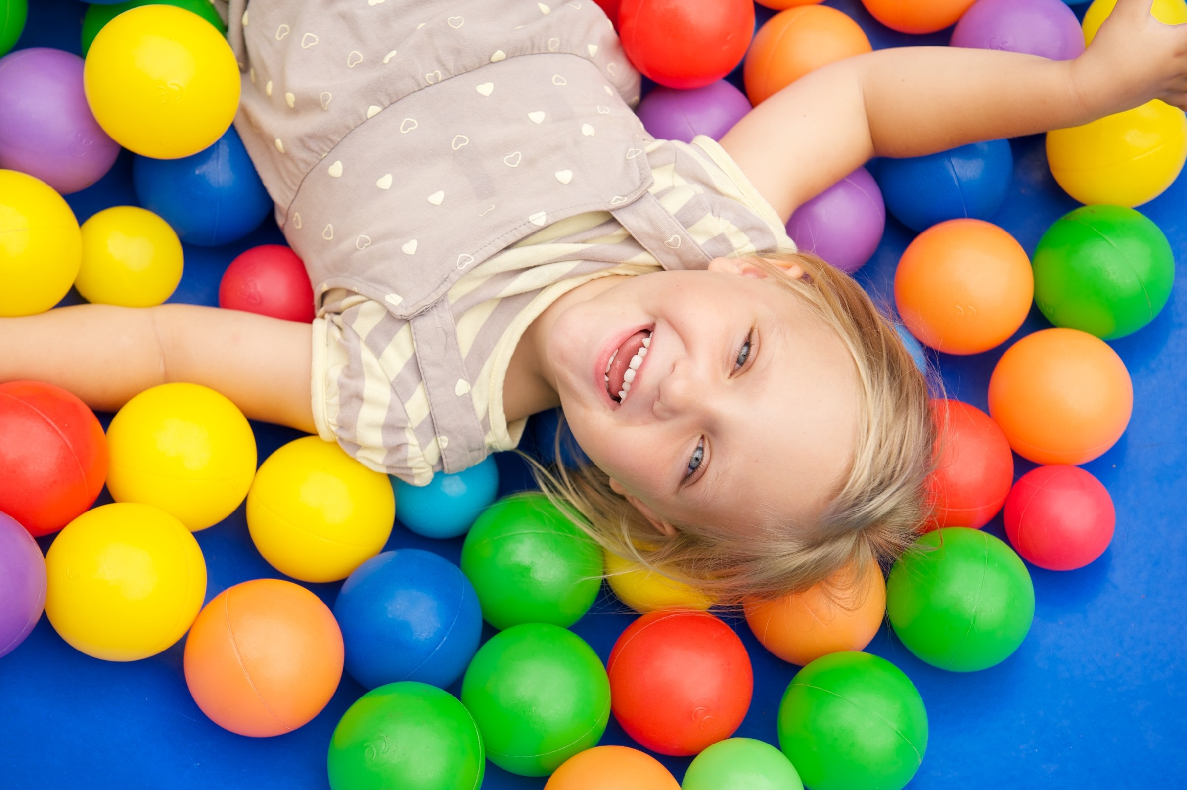 Child enjoying ball pit play at the Sunshine Coast hub