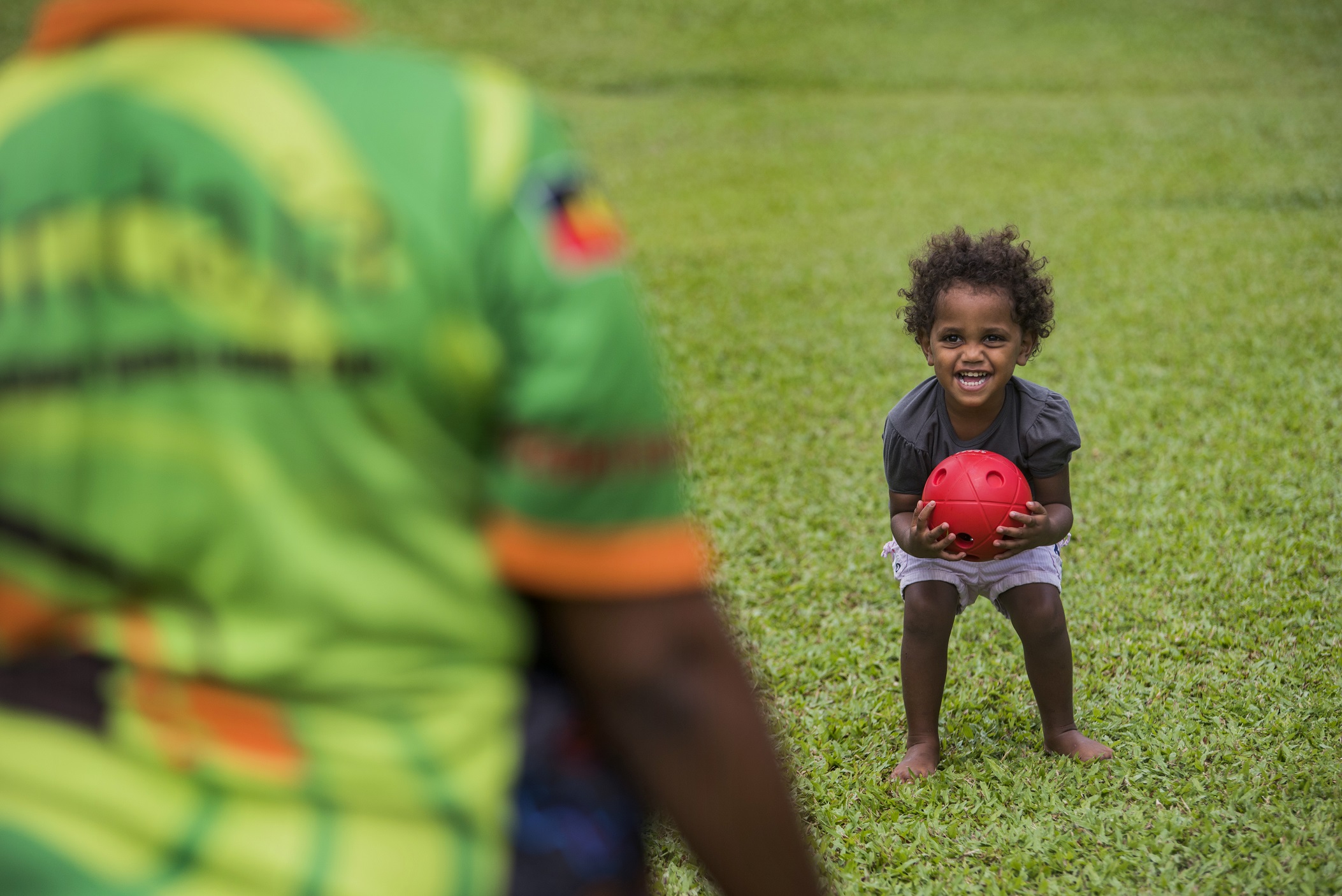 Child with red ball