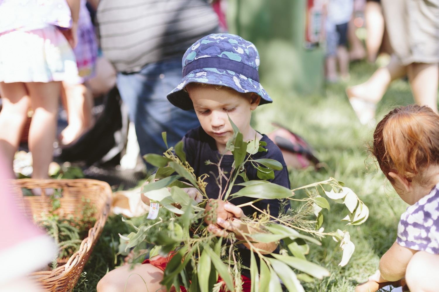 Child playing with leaves