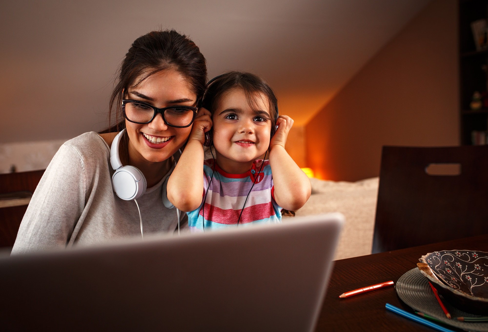 Mum and daughter listening to music