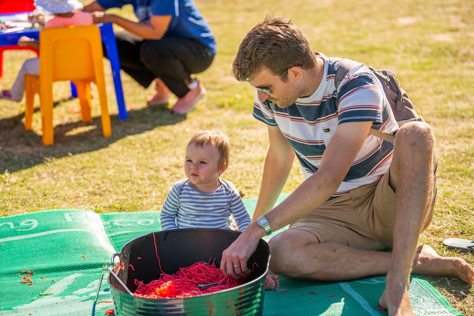 Dad and child with spaghetti