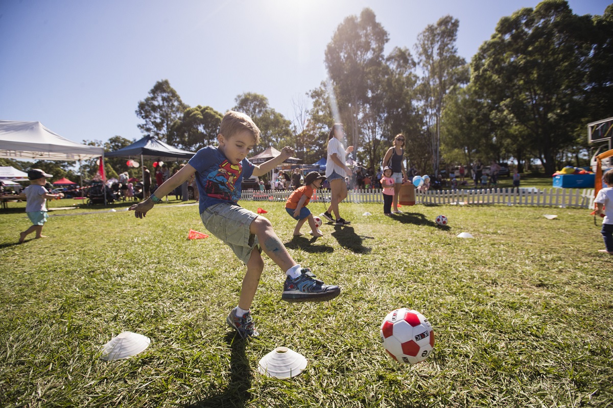 Child kicking ball