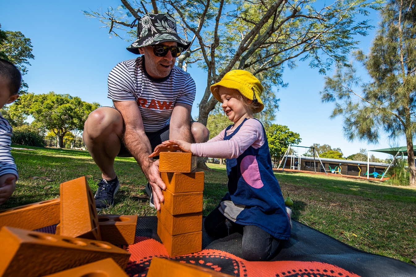 Child and dad with blocks