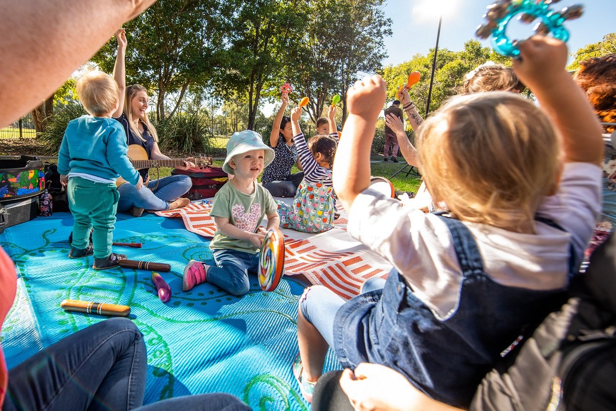 Children outdoors with music
